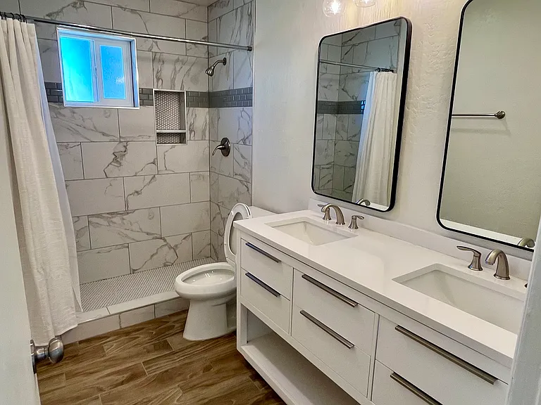 2nd bathroom. Newly remodeled with walk in shower, new vanity, lights, his and hers sinks. New fans, kohler toilet and new privacy window.