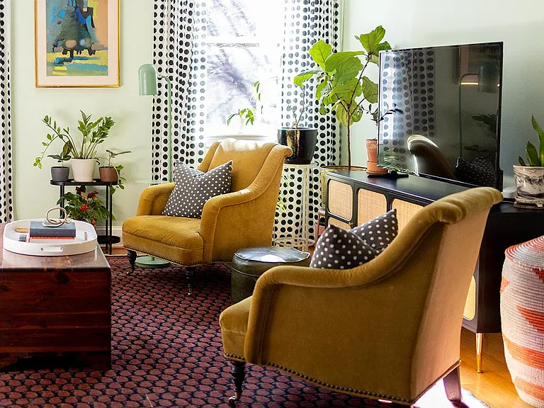 Step into our spacious, inviting living room with a comfy sofa, armchair, and ample natural light. Gather around the large TV for family or solo movie nights.