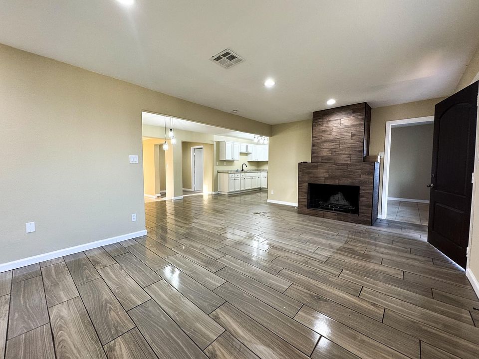 LIVING ROOM WITH WOOD BURNING FIREPLACE