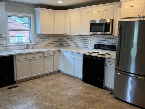 Large remodeled eat-in kitchen with tons of cabinets.