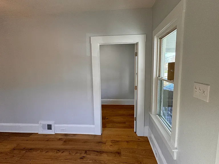 Living room with entrance to bedroom #3 (the smaller of the 3)