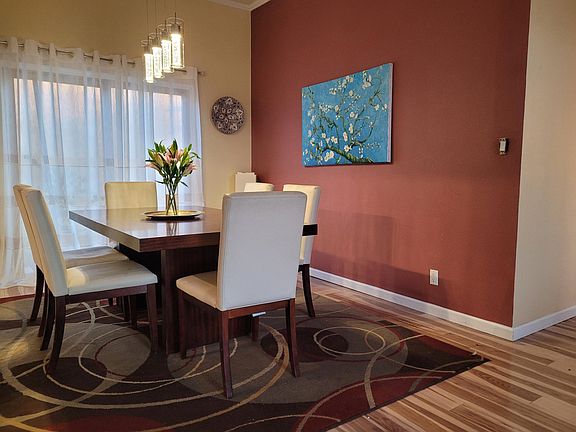 Bright, inviting dining area with natural light and modern charm_perfect for everyday meals or entertaining guests.