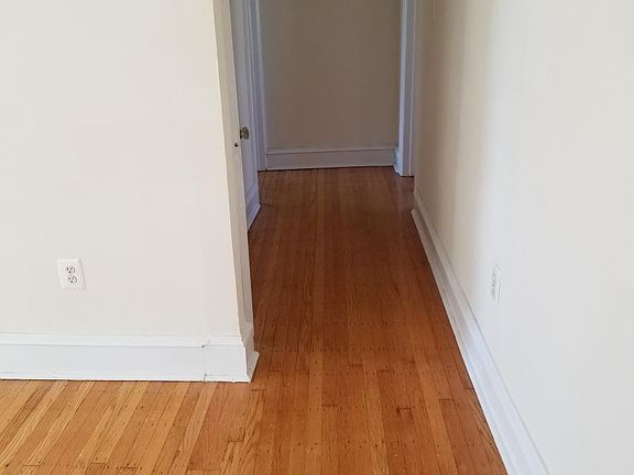 hallway to bedrooms and kitchen