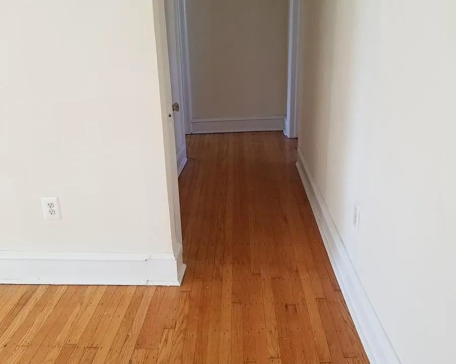 hallway to bedrooms and kitchen