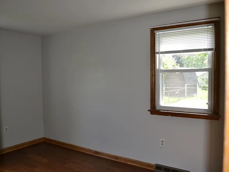 Bedroom 2. Hardwood floors, closet.
