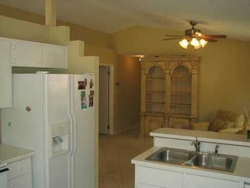 View from Kitchen Over Bar Top and Into Living Room