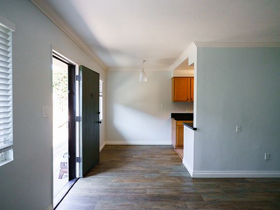 View of front door and dining area from the living room