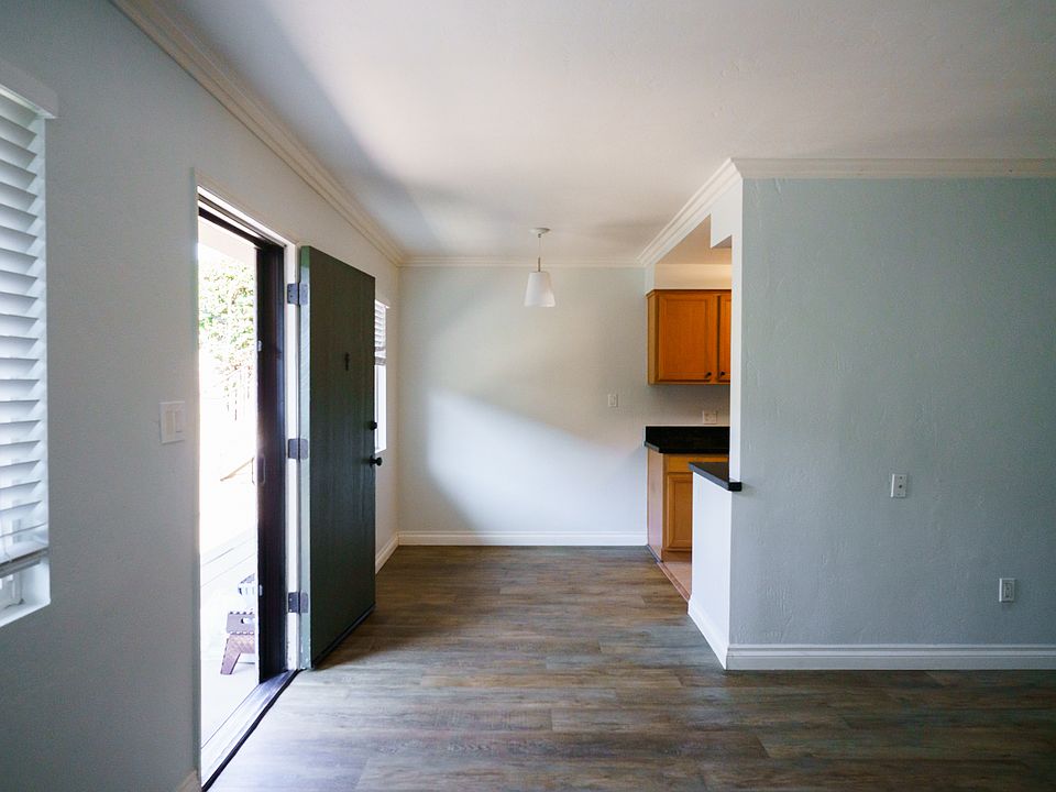View of front door and dining area from the living room
