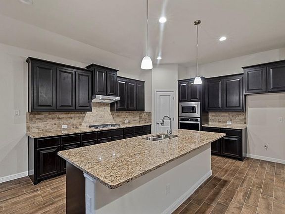Photos shown here may not depict the specified home & features included are for illustration purposes only
