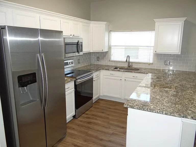 7513 S Mascotte St — Photo 3