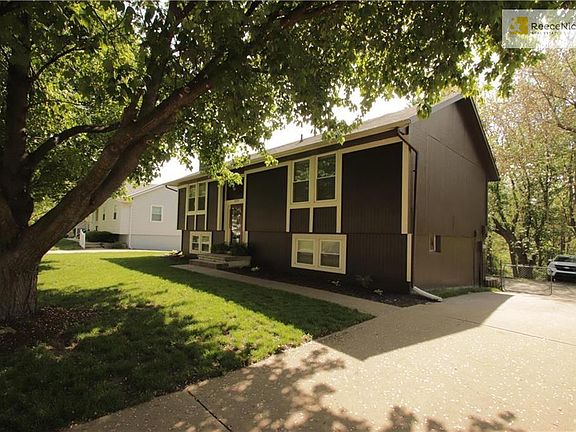 Rear Entry Garages via driveway with parking pad at back of driveway and fenced backyard