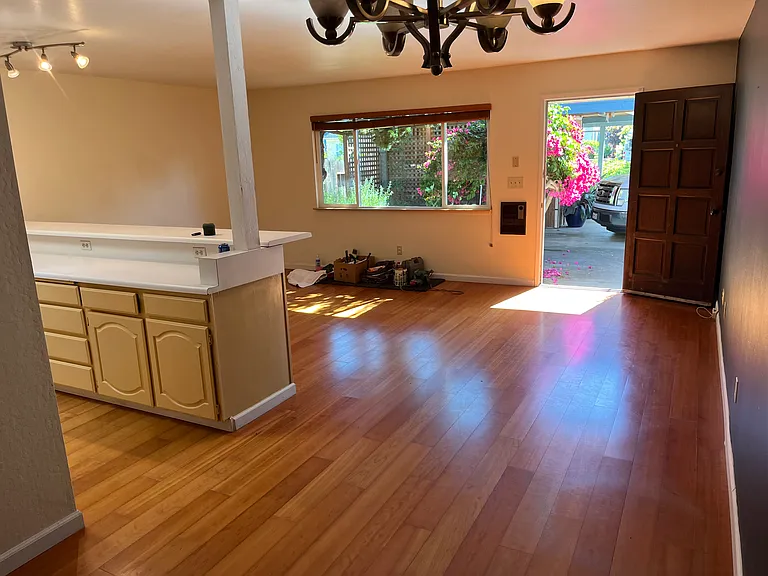 hardwood floors throughout, large galley kitchen, new fixtures, large windows with wooden blinds look onto garden area and carport. Your space is in front of your door.