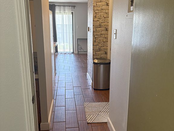 The view from the bedroom to the family room (past the kitchen).