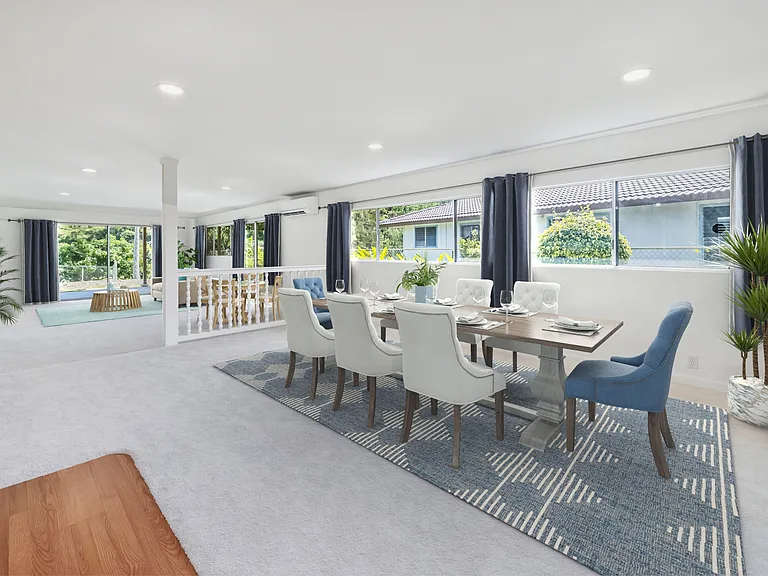 Another view of roomy dining area and family room to the left. There is indoor laundry room to the right of the dining area. Lots of natural light. Split AC to keep you cool.