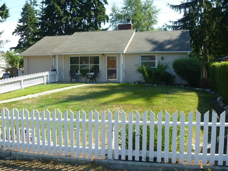 The white picket fence just adds to the street appeal of this cute home.