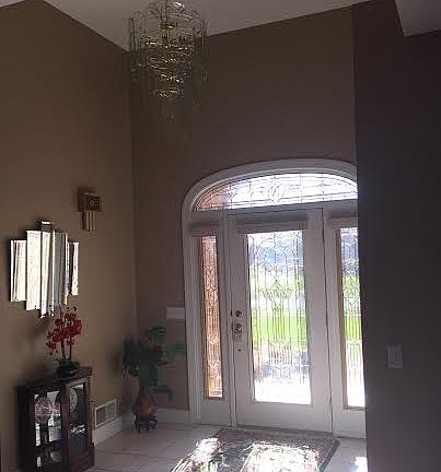 Foyer with leaded glass door