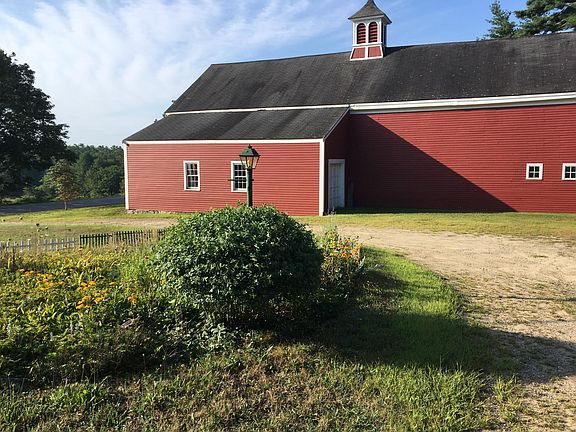 Farmhouse is part of former Meadowsweet Farm. View of neighbor's barn from side porch.