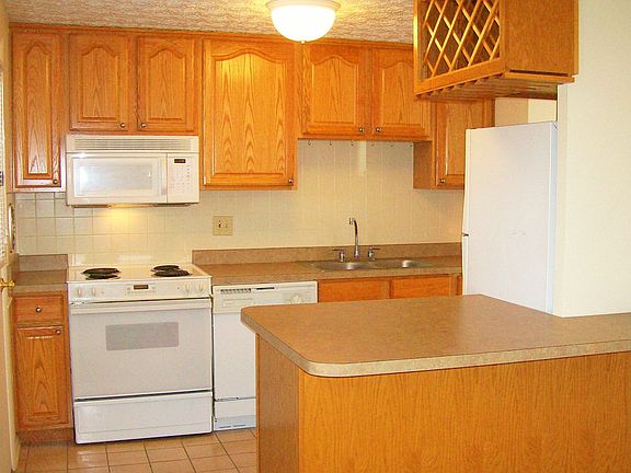 Kitchen,newer cabinets,counters.Tile floor,and tile backsplash.