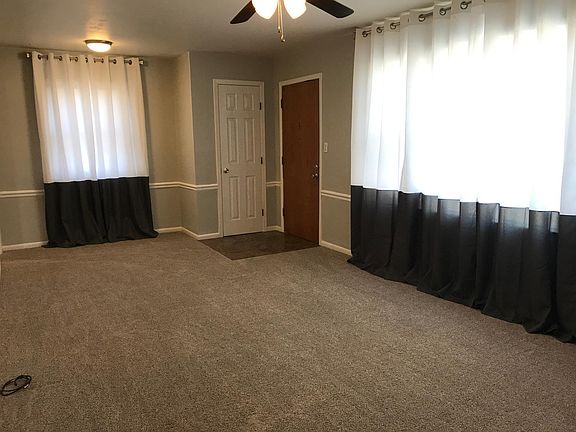 Living room with front coat closet.