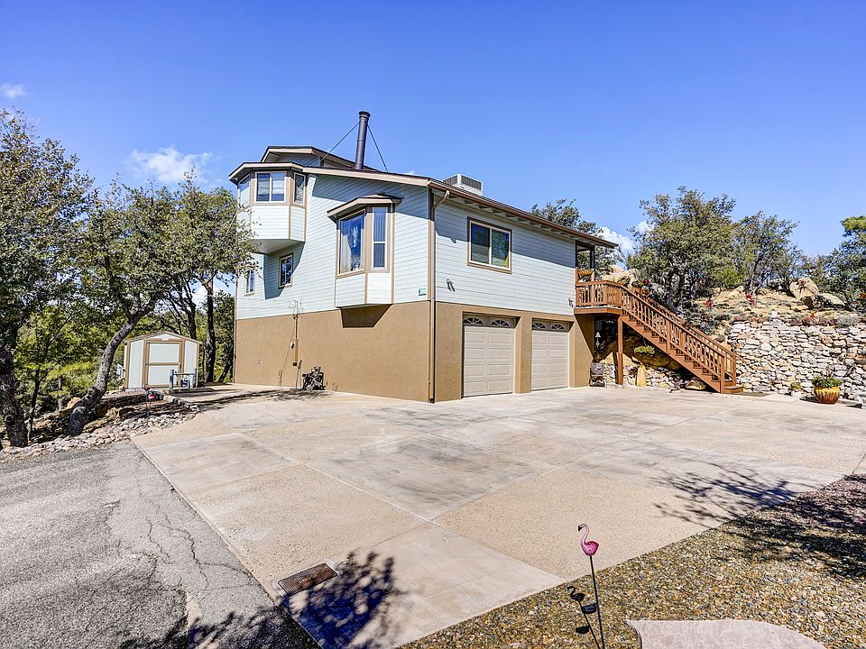 3 story in boulders & trees 