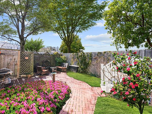 Spectacular Rear Yard with Grill & Seating Area