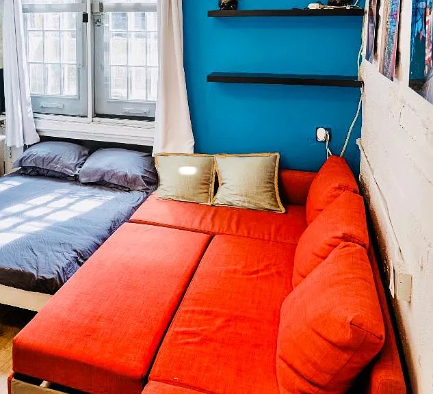 Sofa opens into queen-sized bed. As mentioned before, current blue sofa is exactly the same model as the orange one shown here.