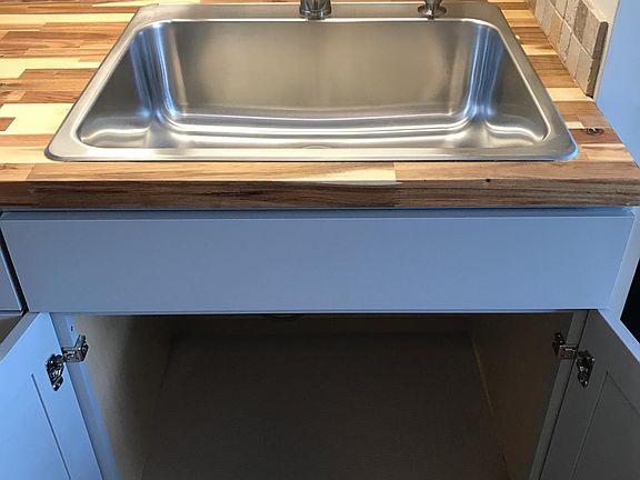 Custom built wood counter with tile backsplash.