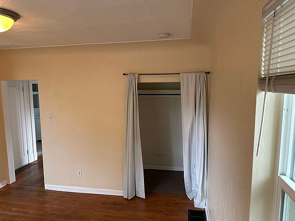 Livingroom with walk in closet storage. View from the front of the room.
