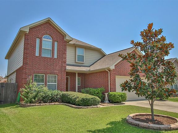 Beautiful and mature shrubbery with a gorgeous Magnolia tree!