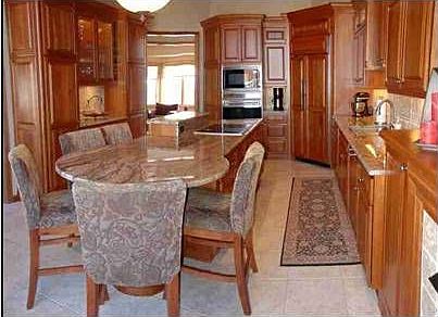 Granite counters & island w/ extended eating area.