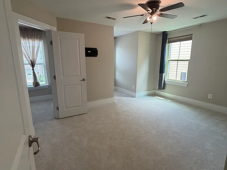 Bedroom #4 features a private en-suite bathroom and a spacious walk-in closet.