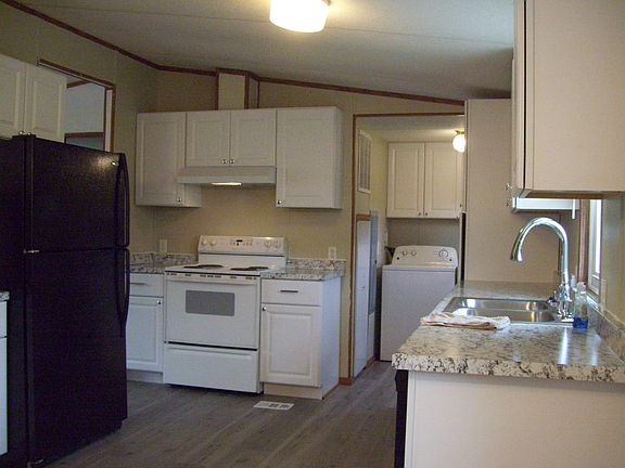 Washer and dryer in area off kitchen