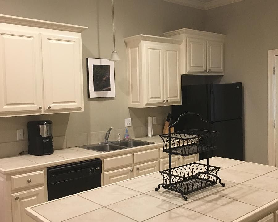Kitchen fully equipped with microwave, cookware, utensils, d
