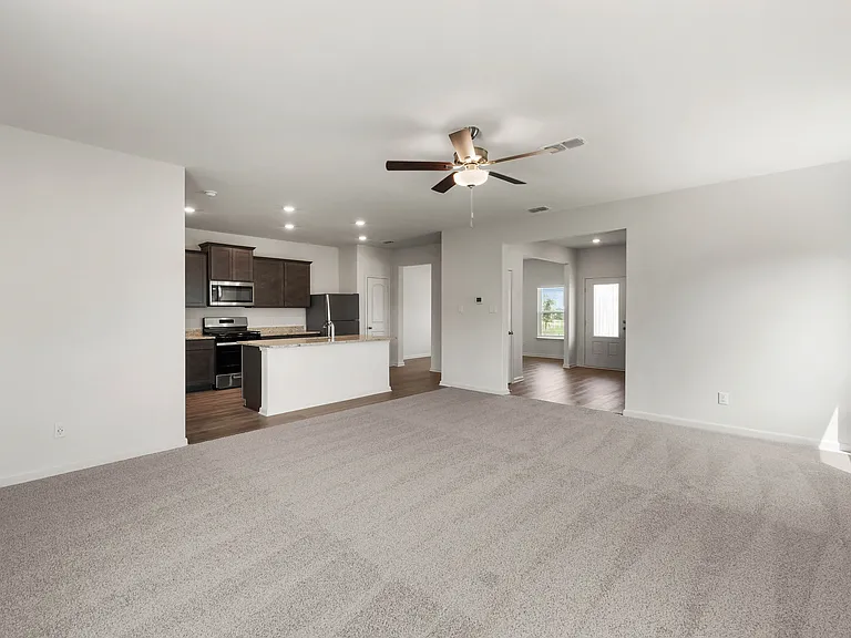The family room is spacious and has plenty of space for furniture.