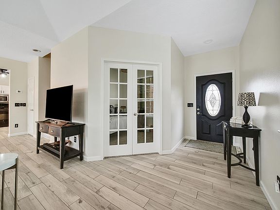 Entry way & French doors to downstairs bedroom
