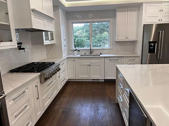 Kitchen w custom cabinets and top of the line appliances