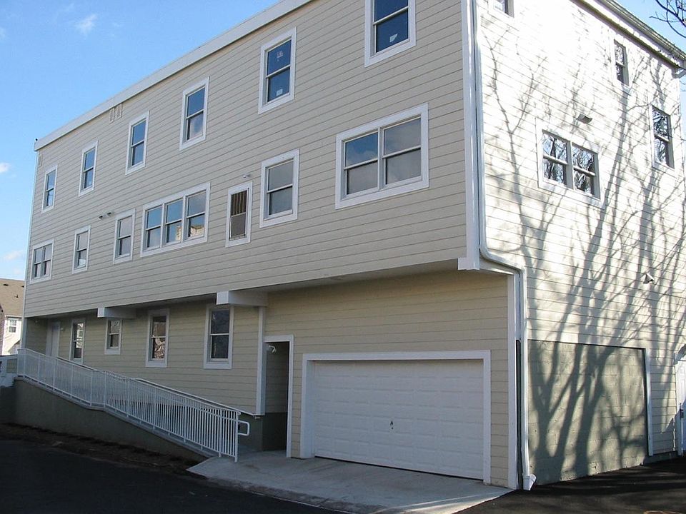 Side view of building towards Bloomfield Avenue. Apt A is on 1st floor accessed via ramp and stairs at second entrance.