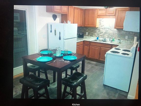 Dinette and kitchen. Back deck is off of the dinette.