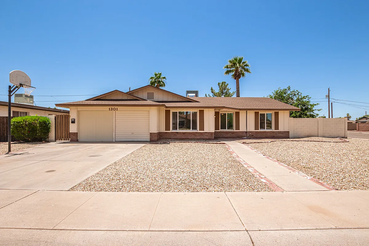 Front of the home and front yard - 1301 E Campus Dr