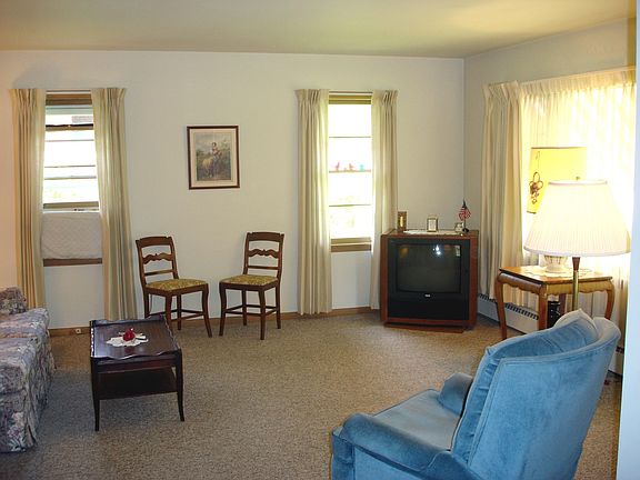 Living Room w/ hardwood under carpet