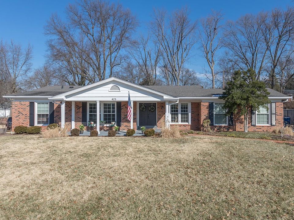 Spacious all-brick ranch style home with charming covered front porch