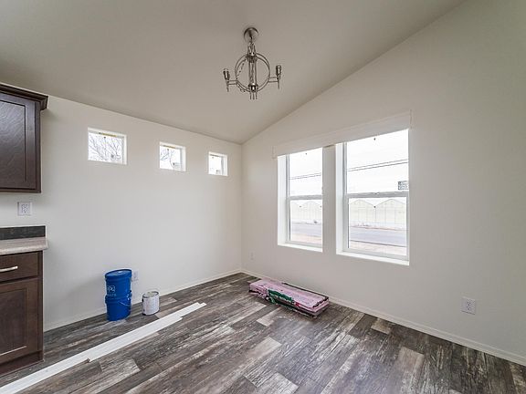 Dining Room - Very open dining area with solid wood built in cabinets, upgraded hardware & tile backsplash. vaulted ceiling.