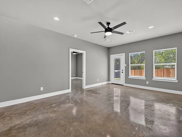 View to backdoor and entry to primary suite