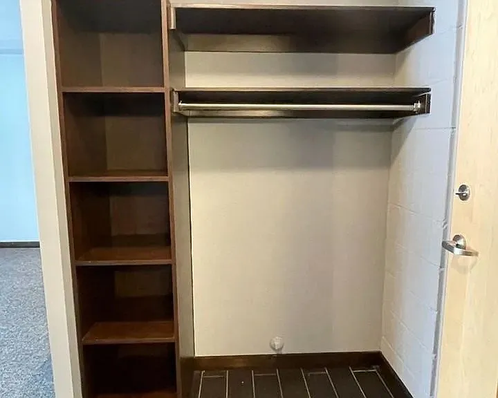 Maximize your storage potential with this spacious closet at LS Capital Group. Featuring built-in shelving and a well-organized layout, itas designed for functionality and style. Ready to upgrade your living space? Inquire now!