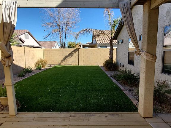 Artifical grass off backyard patio