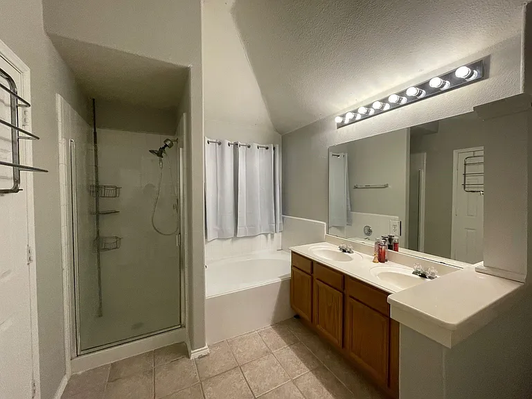 Master bathroom got relaxing tub and a stand in shower