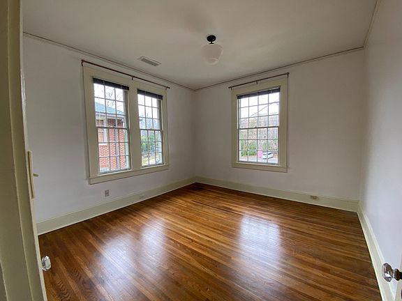 secondary bedroom with single closet; repainted and refinished!