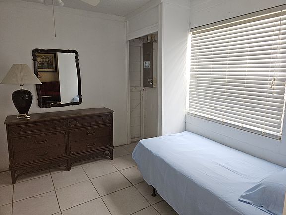 Bedroom furnished with twin size bed.