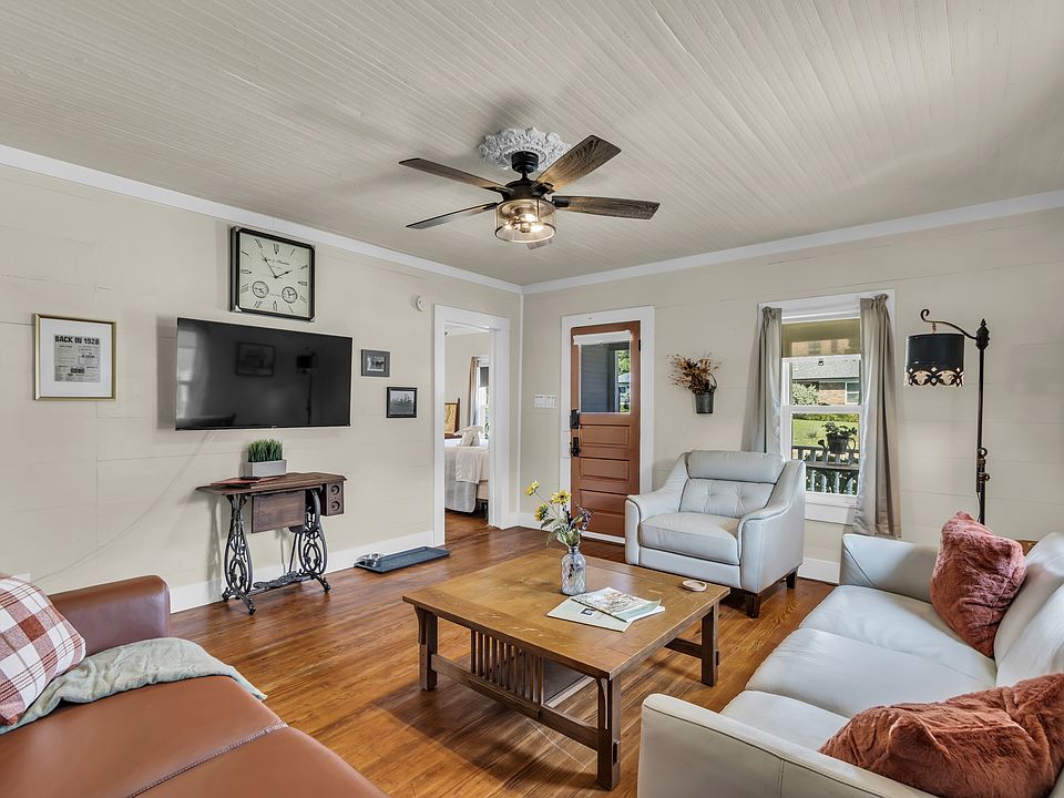 Living room has exposed original shiplap walls and original fir wood floors and ceilings. All new leather furnishings for a comfortable and modern appearance. Original 1928 front door and handle uses new technology on the door lock issuing unique codes.