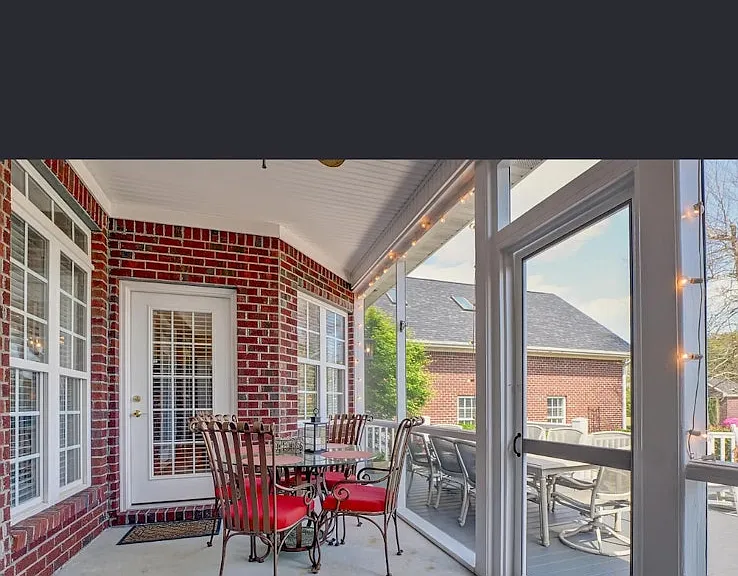 Covered, screened back patio onto large deck